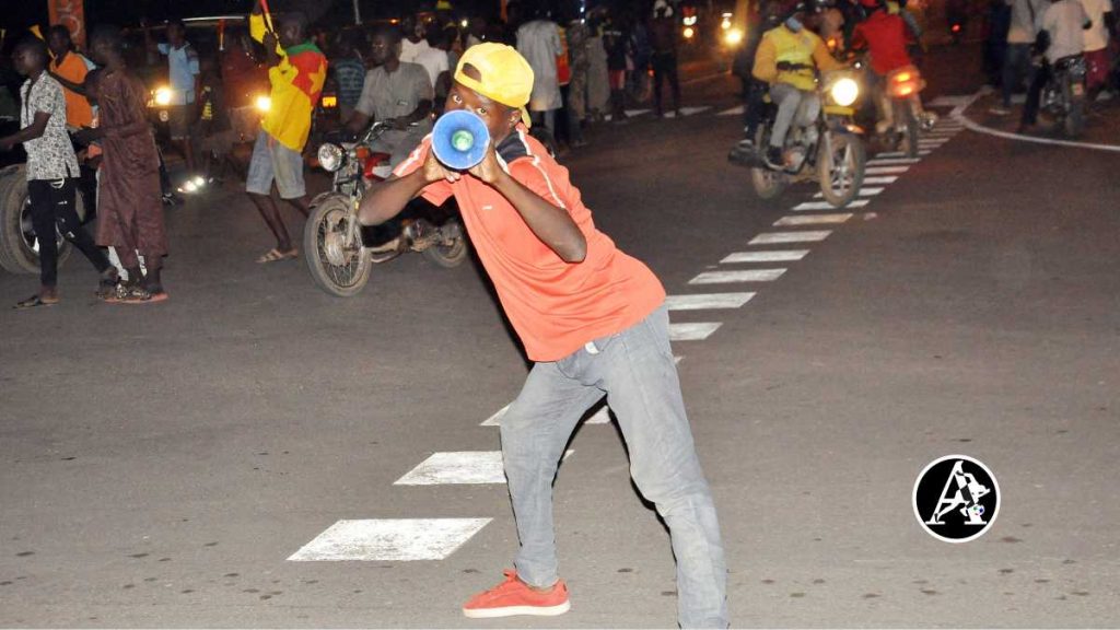 Young Cameroonians celebrating in the streets of Garoua as Vincent Abubakar helped the Indomitable Lions book their place in the knockout stage of the 2021 Africa Cup of Nations (PHOTO CREDIT: Jimoh Otisoro) 