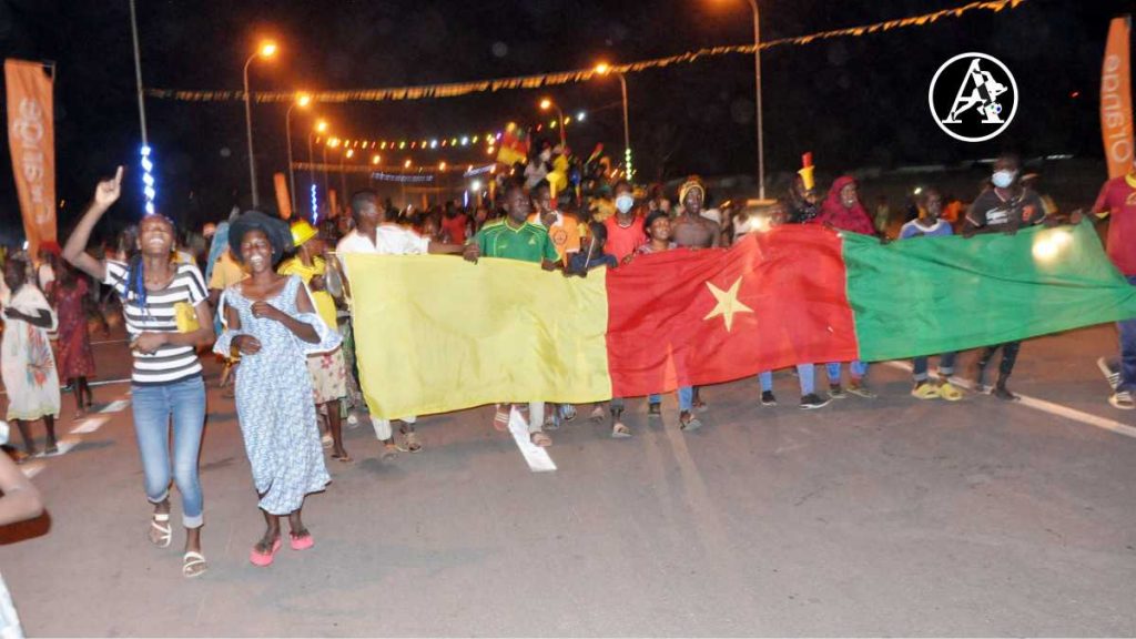 Young Cameroonians celebrating in the streets of Garoua as Vincent Abubakar helped the Indomitable Lions book their place in the knockout stage of the 2021 Africa Cup of Nations (PHOTO CREDIT: Jimoh Otisoro) 