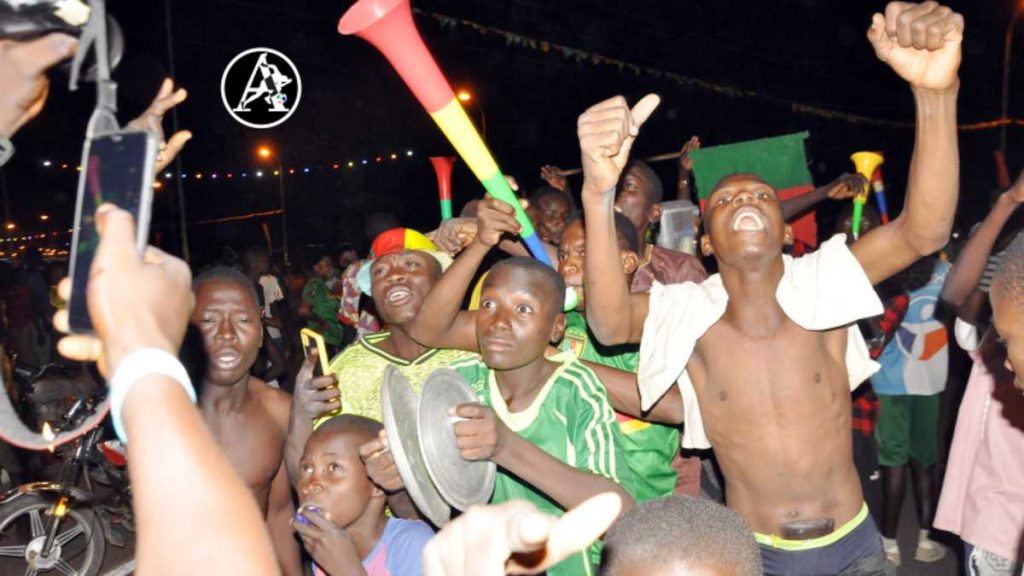 Young Cameroonians celebrating in the streets of Garoua as Vincent Abubakar helped the Indomitable Lions book their place in the knockout stage of the 2021 Africa Cup of Nations (PHOTO CREDIT: Jimoh Otisoro) 