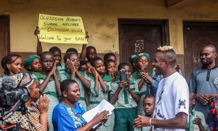 Super Eagles striker Victor Osimhen has returned to Nigeria to bring some holiday joy to the people of Olusosun, Ojota, where he spent his early years.