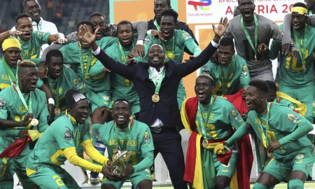 thiaw lifting the chan trophy with senegal