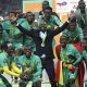 thiaw lifting the chan trophy with senegal